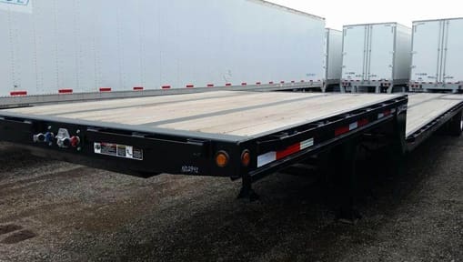 Image from: https://www.mylittlesalesman.com/2020-demco-53x102-tandem-axle-steel-drop-deck-trailer-air-ride-fixed-spread-axle-9895867